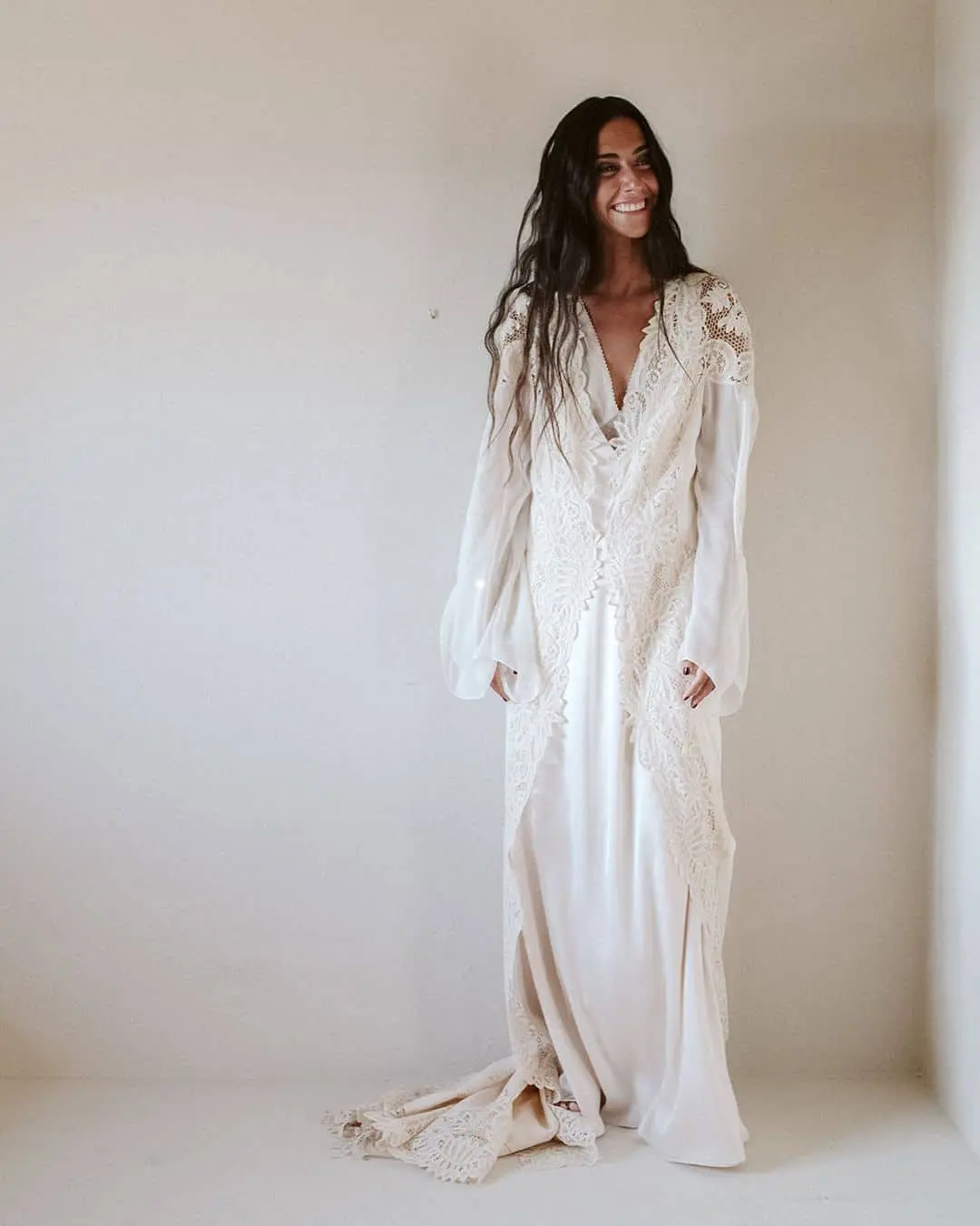 Claudia Llagosterá posing in a wedding dress designed by herself.