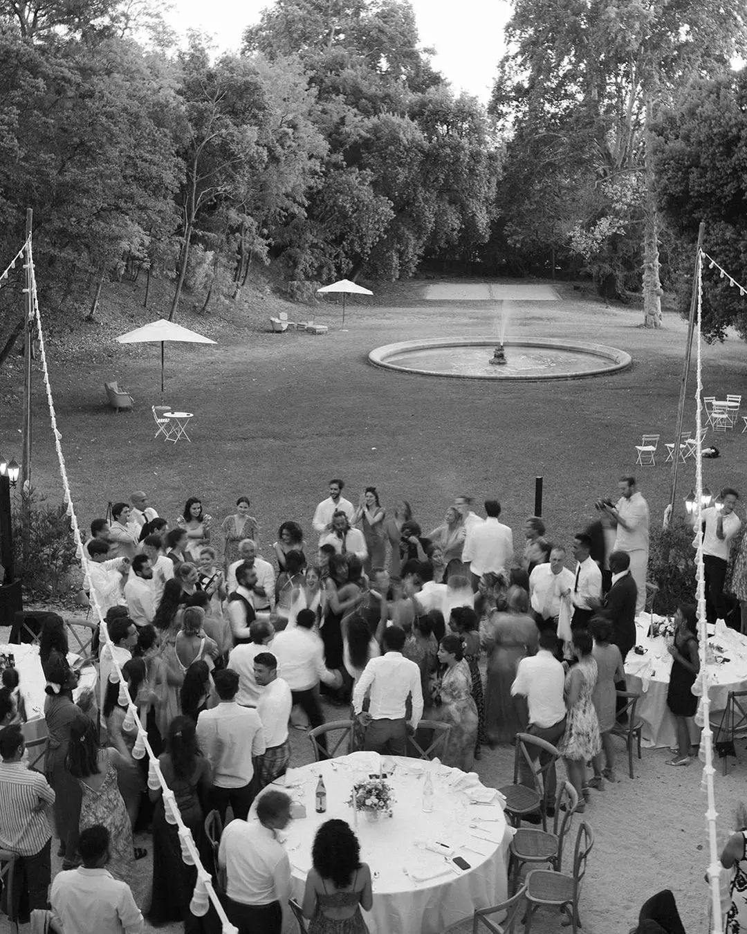 Wedding guests displaying proper behavior in an elegant garden